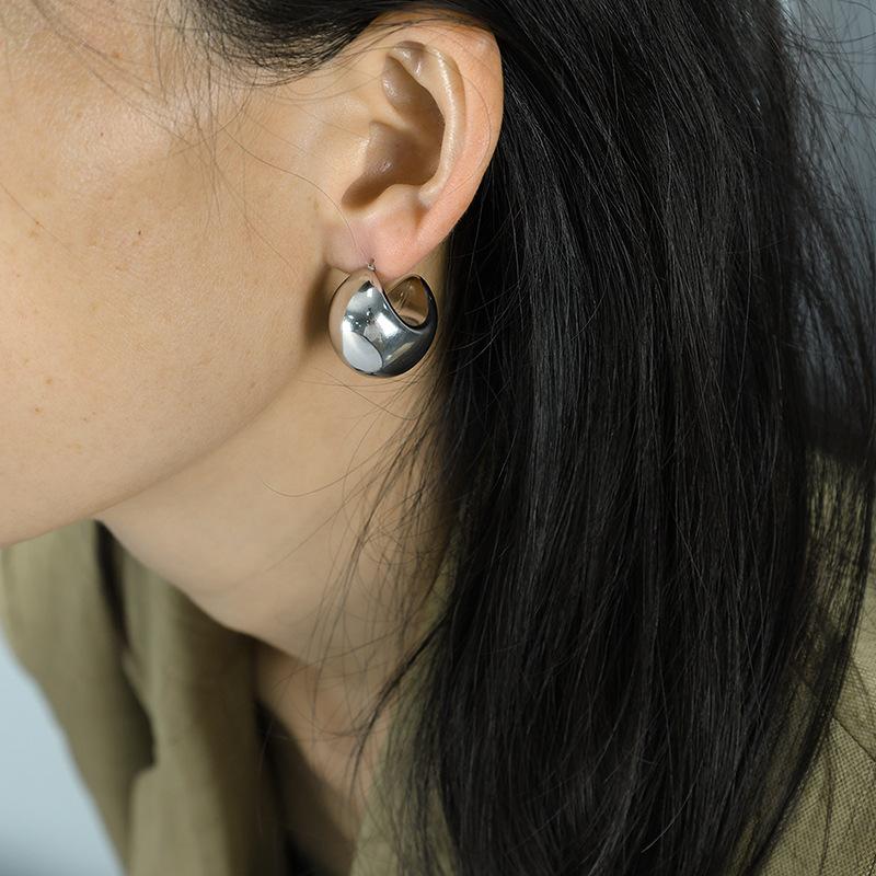 Design Doudou earrings women s simple semi-round fat moon earrings metal-sensitive glossy hollow earrings