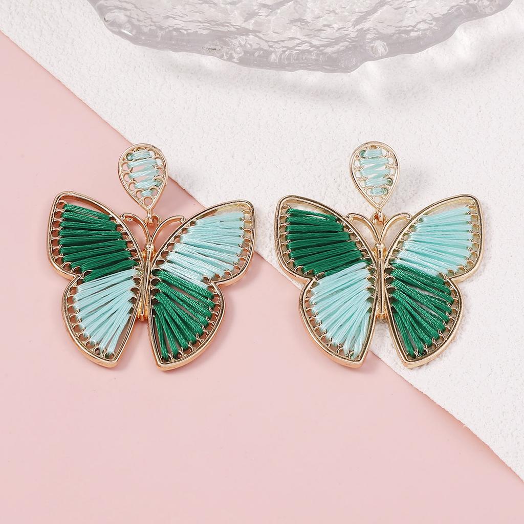 New handmade wound woven butterfly earrings alloy frame dancing fresh and sweet wind earrings