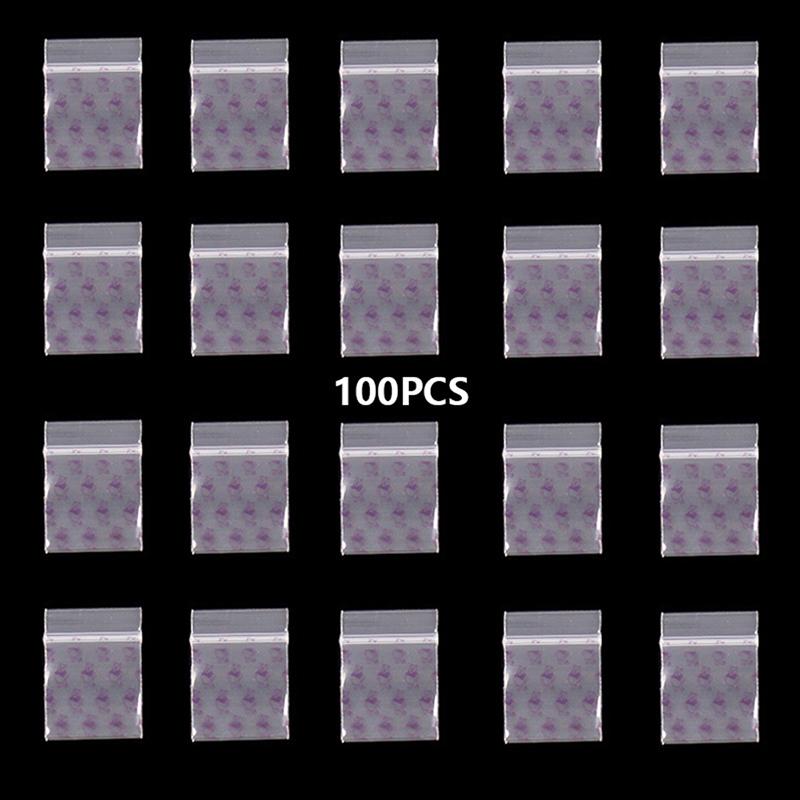 

100 шт. маленькая сумка на молнии с рисунком черепа, портативная сумка для хранения, прозрачная
