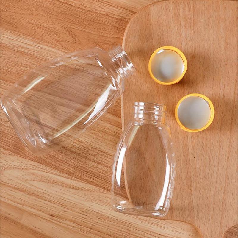 Transparent Reusable Plastic Honey Bottles Squeeze Honey Bottle Container Holder With Lid For Storing And Dispensing Honey Jar