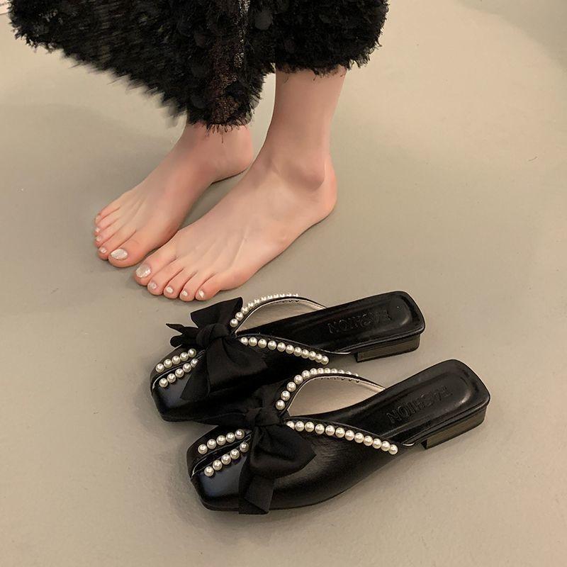 Korean version of bow-tied cool slippers for women's summer wear 2025 new versatile pearl bag head half slippers flat-bottomed lazy shoes
