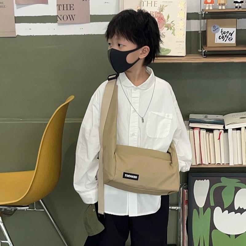 Lightweight Fashionable And Crossbody Bag For Kids Featuring Fun Letter Graphics And Modern Style