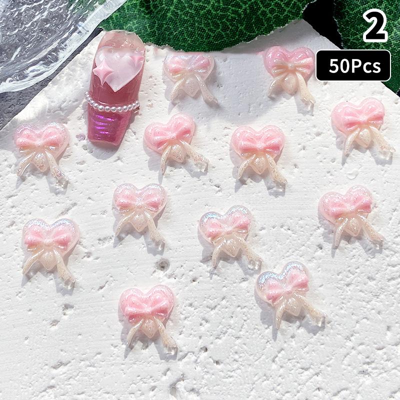 50Pcs Pink Series Bow Heart Resin Nail Charms 3D Luminous Double Butterfly Peach Heart Sweet Wind Nail Art Decorations DIY Nails