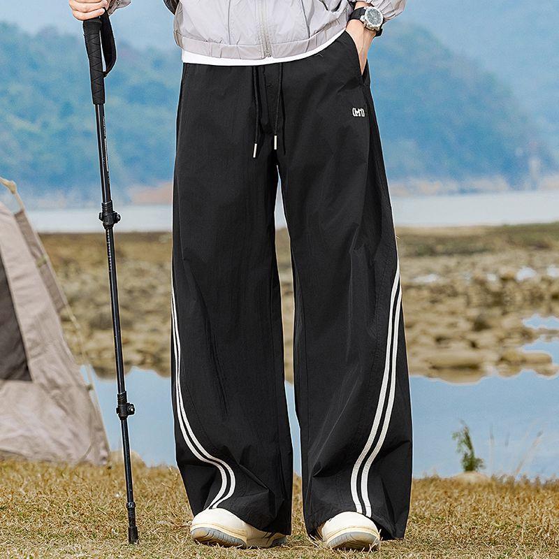 Spring and summer new European scimitar striped loose khaki wide-leg casual pants men's very light pants