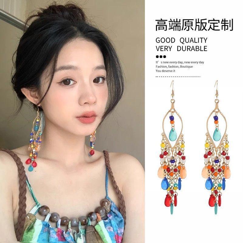 

Рисовые бусины стеклянные бусины цветные капли воды серьги с бахромой женские серьги в отпускном стиле высокого класса с модными универсальными серьгами для темпераментных женщин