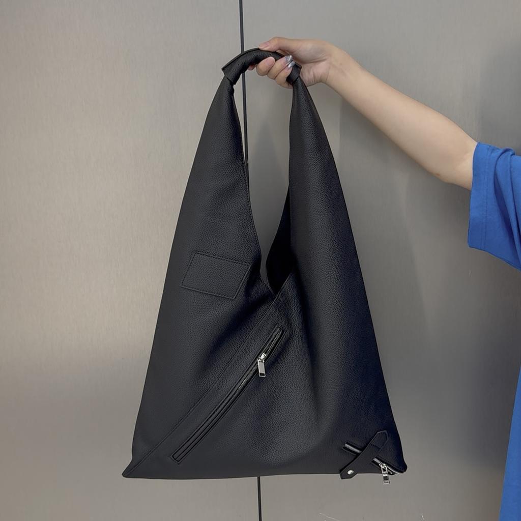 Cross-border first-layer cowhide commuter large-capacity women's bag zipper triangle bag versatile portable shoulder lazy wind underarm bag