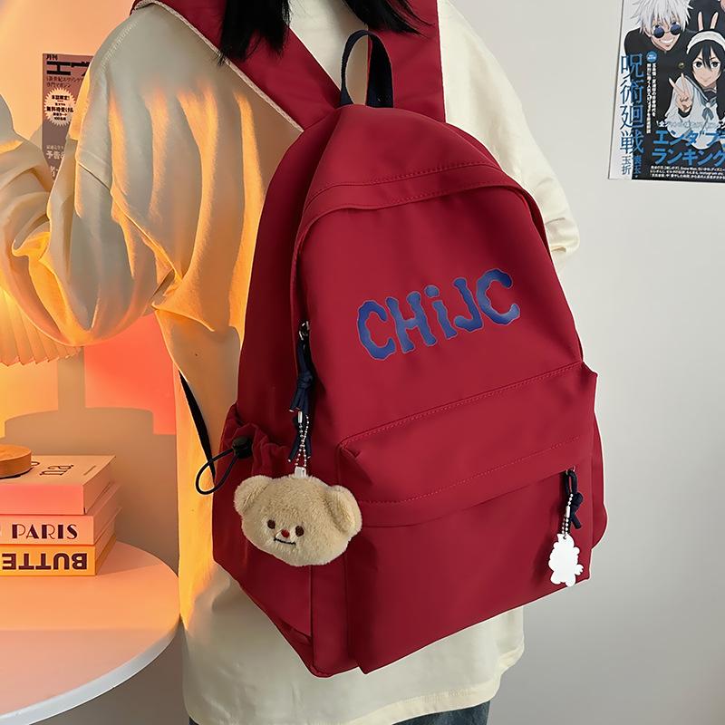 

The new letter trendy and cool student schoolbag is light and large-capacity, and the simple backpack for junior high school students красный
