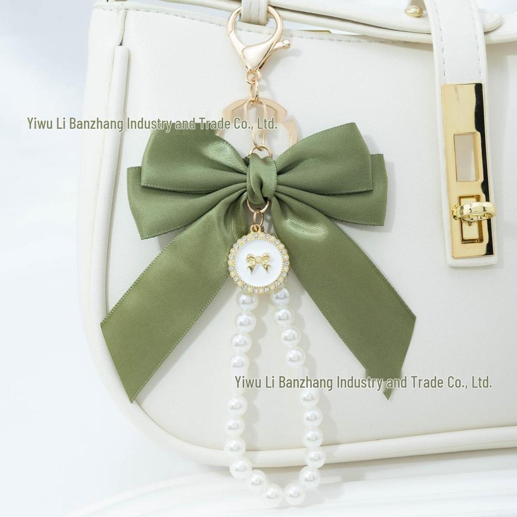 Large Bow Faux Pearl Bracelet Keychain with Colored Woven Strap and Alloy Tag Pendant
