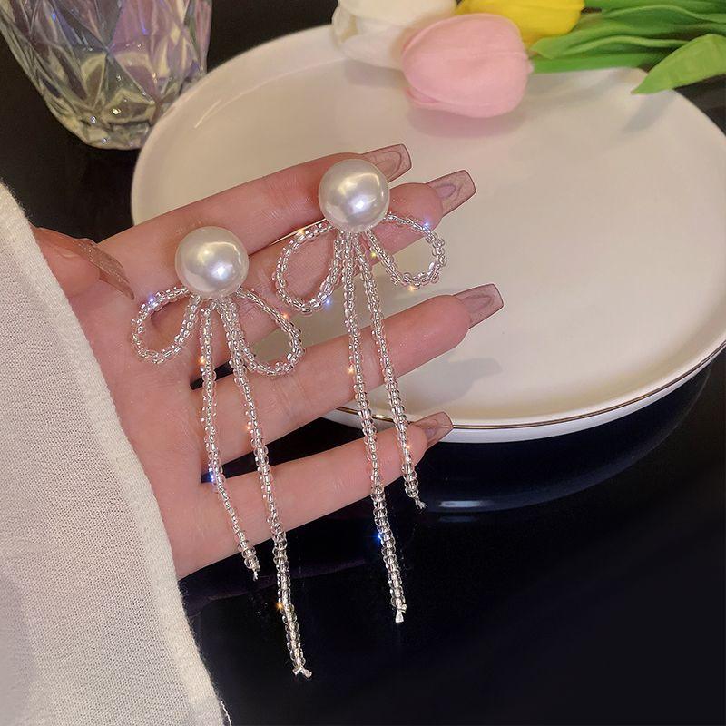 

Жемчуг Лето Женский Южная Корея Интернет Знаменитость Уникальные Банты Pearl tassel-Silver Needle