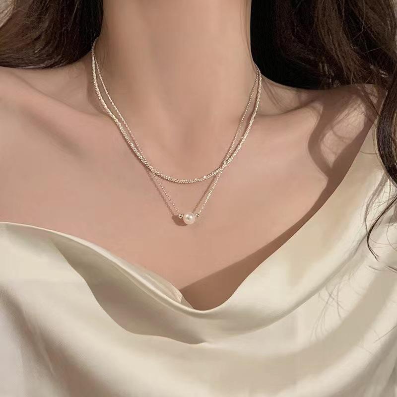 Double-layer stacked pearl necklace women s sparkling temperament design sense niche neck chain collarbone chain 2025 new