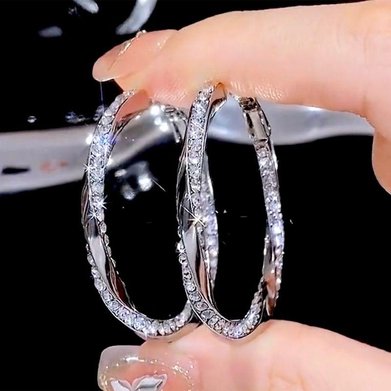 

Style French Micro-Encrusted Diamond Twisted Earrings, Versatile and Unique Large Hoop Earrings with a Slimming Effect and a Light Luxury Feel Micro-Paved Diamond Twisted Hoop Earrings
