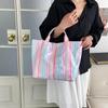 This Water-Resistant Pvc Tote Bag Features A Pink And Blue Striped Design, A Large Capacity, And Is Suitable For Beach Shopping,