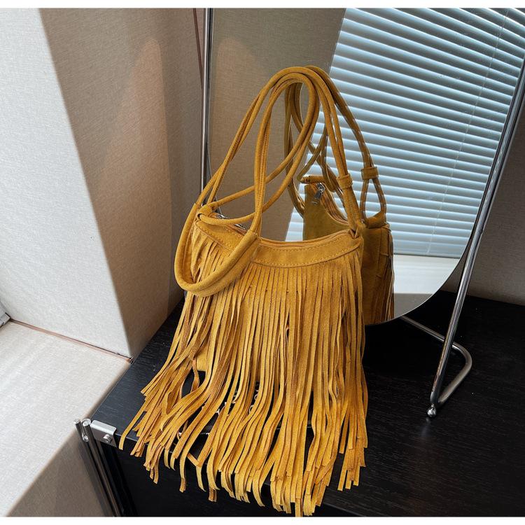 Oblique span tassel bag women's new fashion retro travel versatile bucket bag