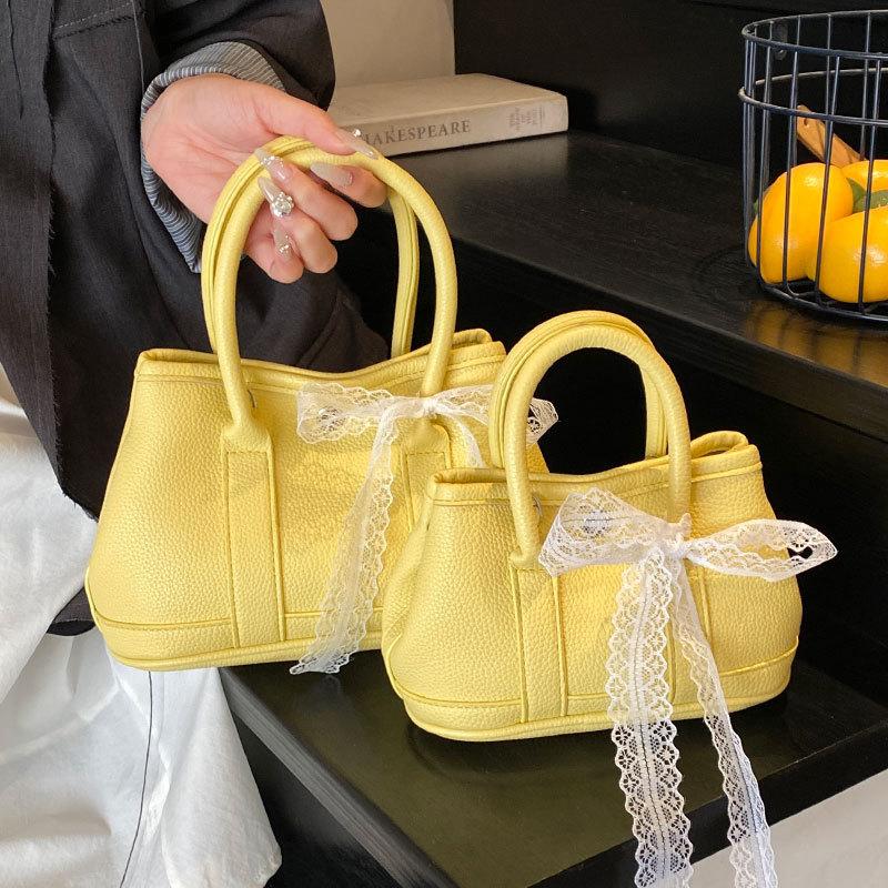 Korean fashion simple casual style portable bucket bag femininity high sense commuting versatile solid color messenger bag