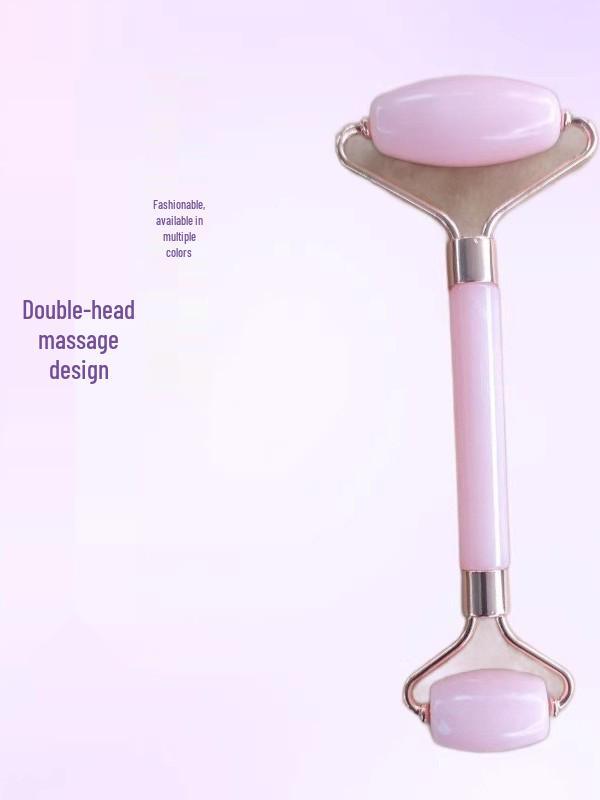 Heart-Shaped Rose Quartz Facial Roller & Gua Sha Massager for Skin Lifting and Muscle Relaxation.