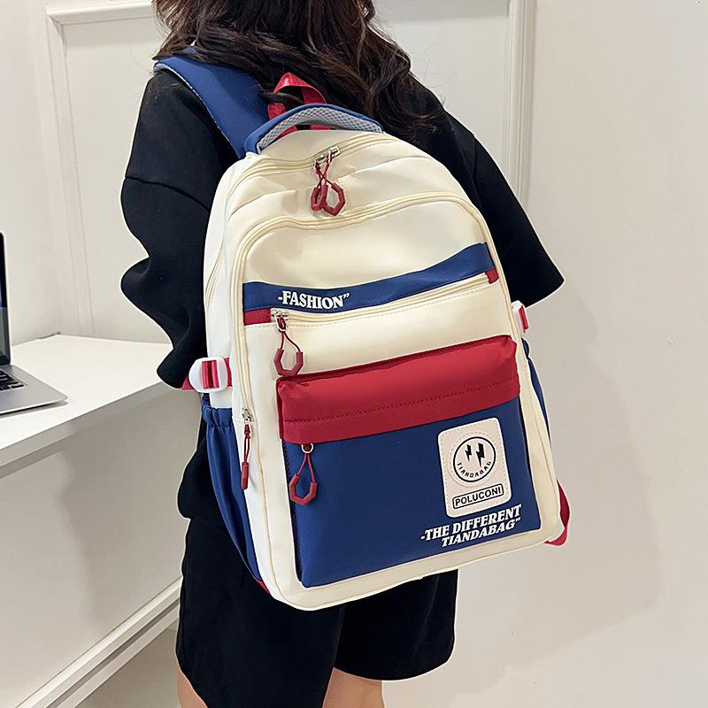 Hot-selling retro tooling wind contrasting color backpack male and female junior high school students versatile tide large-capacity schoolbag
