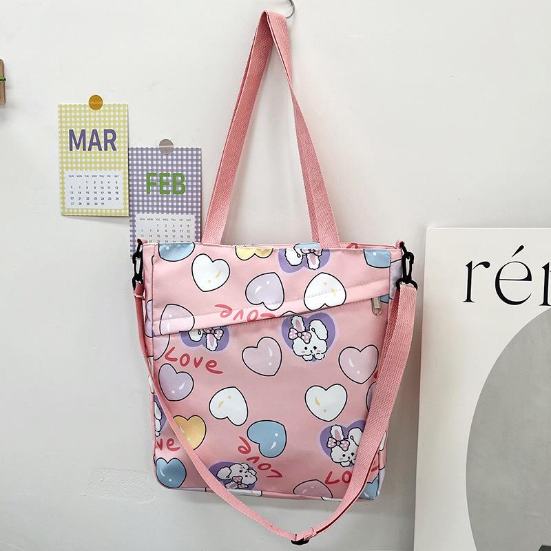 

Сумка из нейлонового холста женская новинка 2024 года с рисунком из мультфильма сумка-тоут женская сумка через плечо портативная сумка для покупок розовый