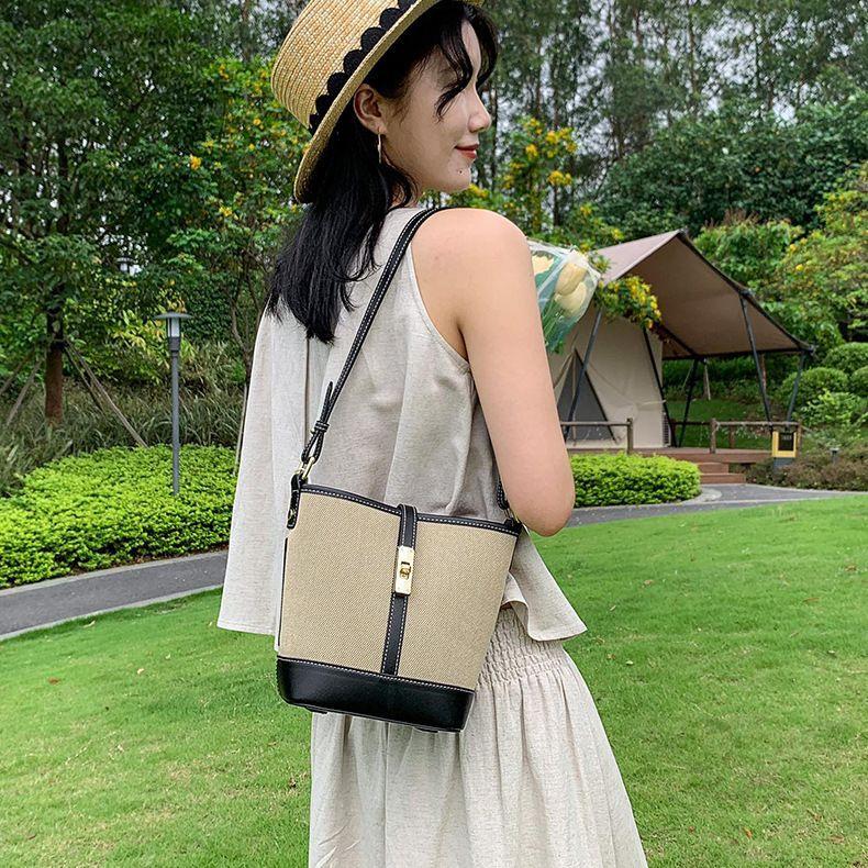 Cowhide canvas splicing bucket bag women's 2025 summer shoulder oblique span bag casual versatile underarm bag Korean version tide