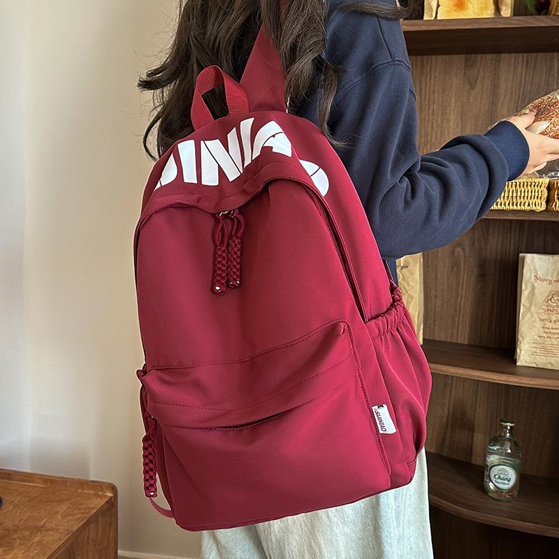 Hochwertiger modischer einfacher Buchstaben-Print lässiger Rucksack Schüler vielseitig große Kapazität Pendlerrucksack