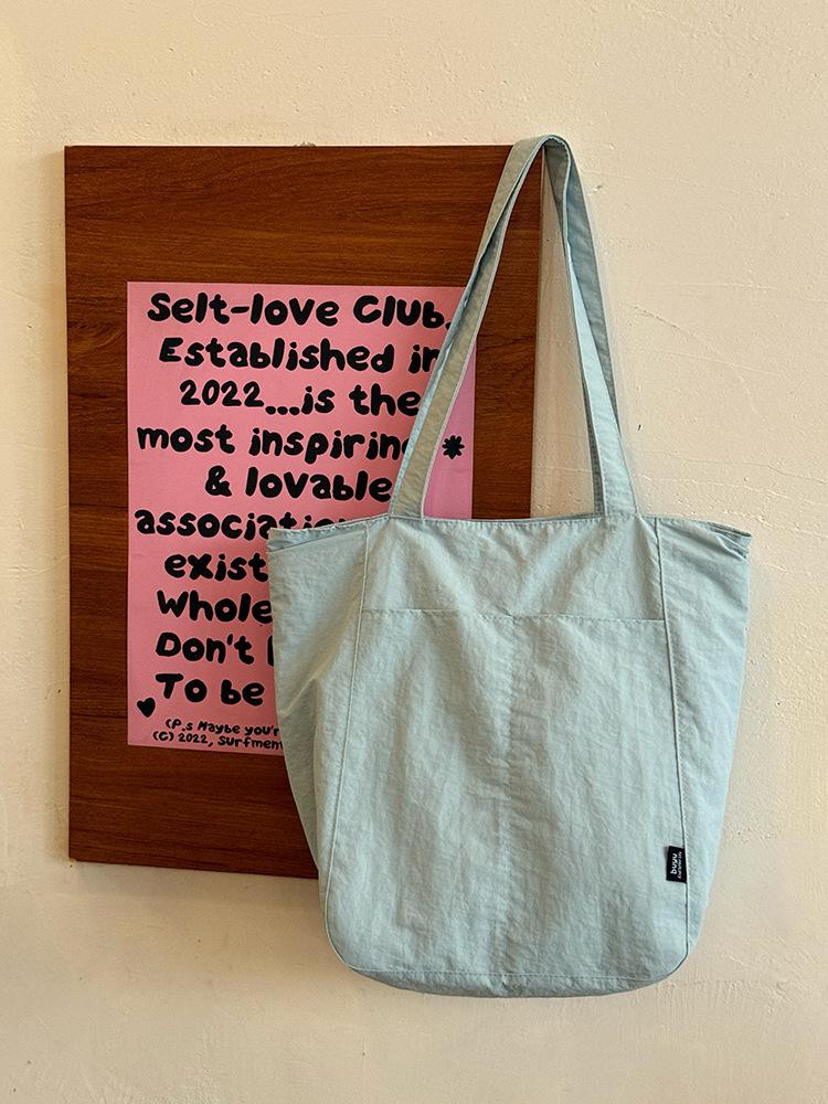 Korean simple solid color canvas bag women's 2025 new large-capacity lightweight shoulder tote bag versatile commuter bag