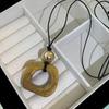 2025 New Chinese Style Unique Resin Pendant Necklace - Retro Niche Long Sweater Chain for Women
