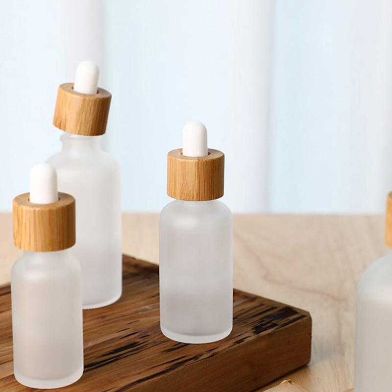 Tomma droppflaskor av glas Ögonpipett Trä Bambu Lock eteriska oljor 5Ml-100Ml