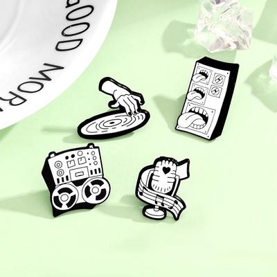 Trendy Brooch: Cool Music World Speaker with Microphone and Tongue Design