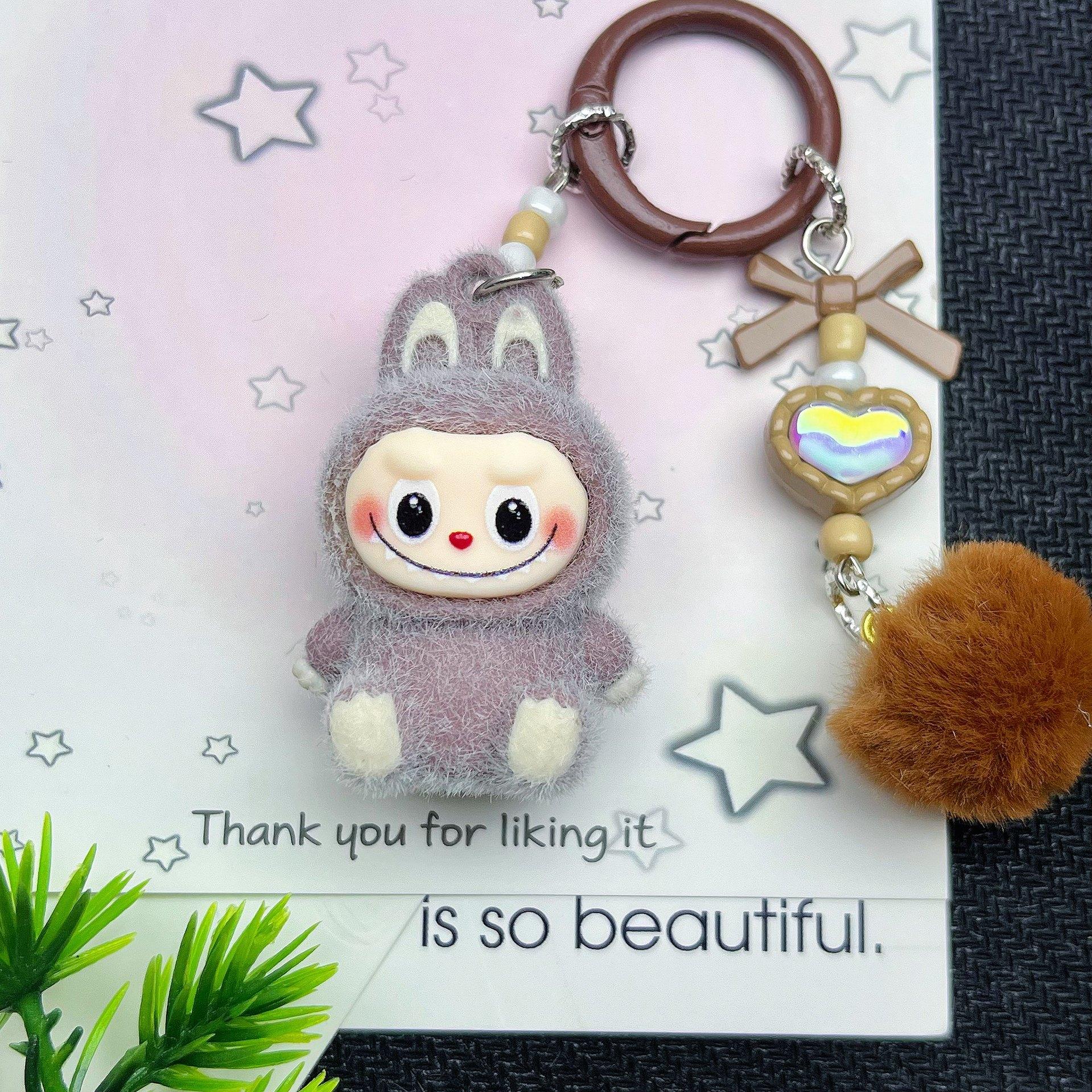 

Флокированный сидячий брелок Одиночная кукла Сделай сам Милые зерновые аксессуары Мягкий клей Милый зерновой малыш Сумка для прогулок Подвеска для мобильного телефона