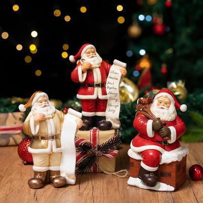 Malá pryskyřičná figurka Santa Clause, soška Santa Clause s dárkovou taškou/seznamem přání pro římsu, knihovnu, stolní desku, dekorace na novoroční párty