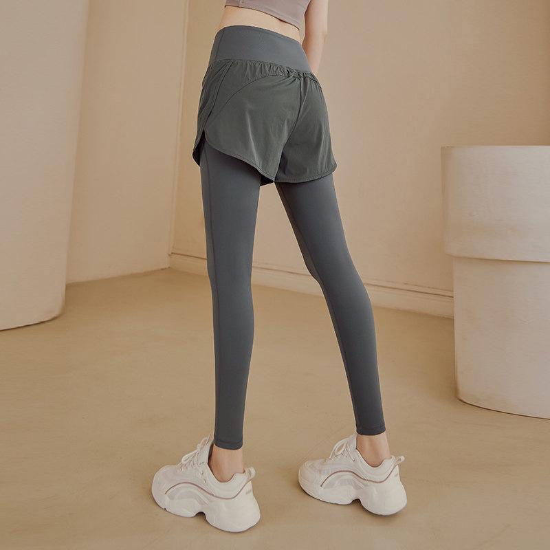 

High-Waisted Plus Size Women s Quick-Dry Leggings with Pockets – Fake Two-Piece Yoga Pants for Running, Fitness, and Butt Coverage XL (115-125 jin) серый