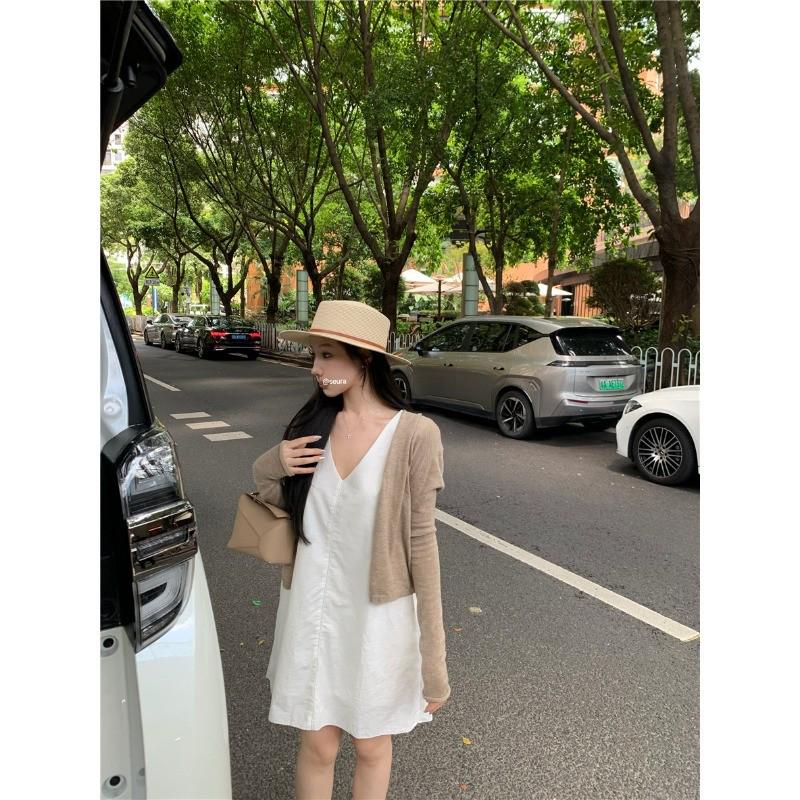 Women's Stylish V-Neck Sleeveless Summer Dress: Loose Fit, Slimming, Solid Color, Short Skirt - New Fashion Collection.