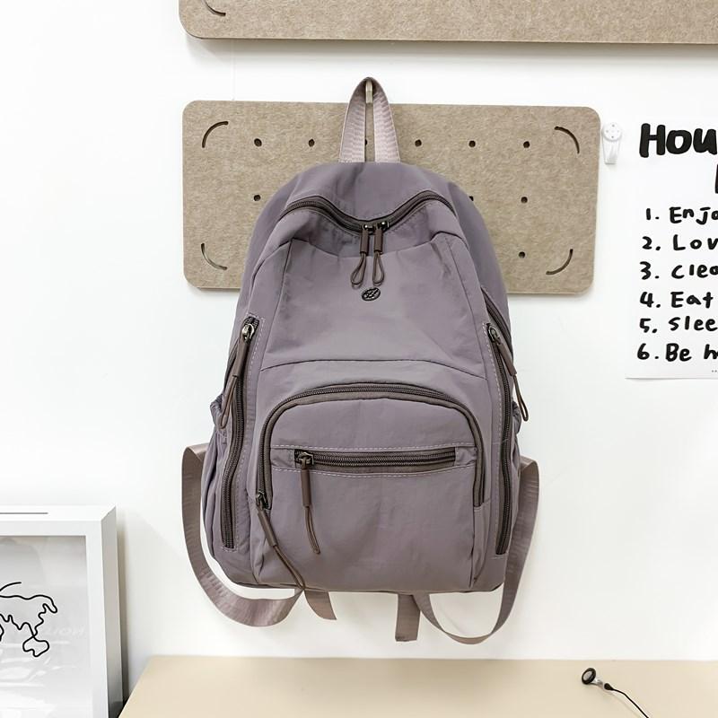 

Lightweight schoolbag female solid color water-proof multi-pocket computer commuting backpack college student class travel backpack темно-фіолетовий колір