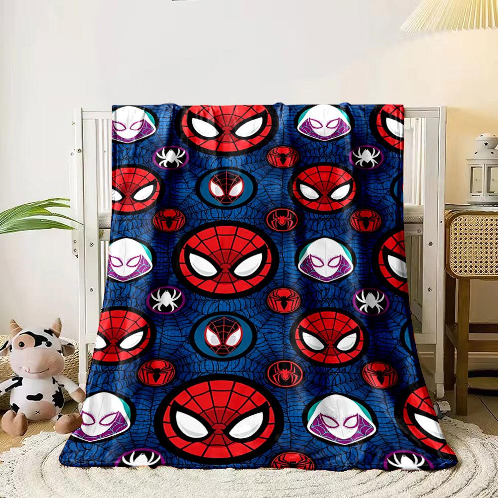 Spider-themed masks and logos repeat over a blue web-textured background. for all seasons blanket lunch break throw gift 80cm x 120cm