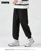 Men's American-Style Autumn Overalls: Fashionable, Casual, Versatile Nine-Point Pants with Loose Cuffs and Multi-Pocket Design.