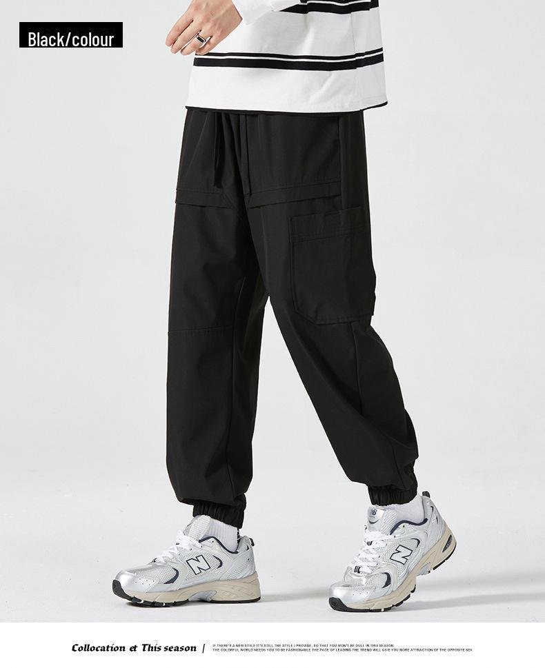 Men's American-Style Autumn Overalls: Fashionable, Casual, Versatile Nine-Point Pants with Loose Cuffs and Multi-Pocket Design.