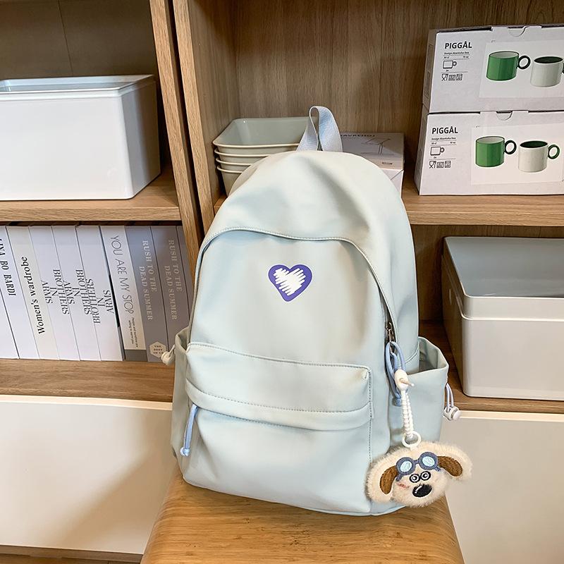 School bags, female college students, simple solid colors, love, junior high student, niche and versatile girls, high school student backpacks, trends