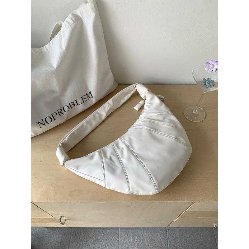 

Новая женская сумка-пельмень из мягкой кожи, большая вместимость, на плечо, летняя, женская, универсальная, нишевая, студенческая, повседневная, круассан бежевый