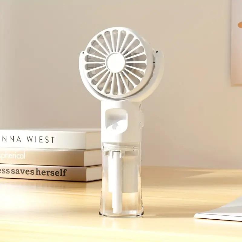 Portable hand-held spray fan with humidifier -4-speed adjustment, USB charging small fan, suitable for office or travel