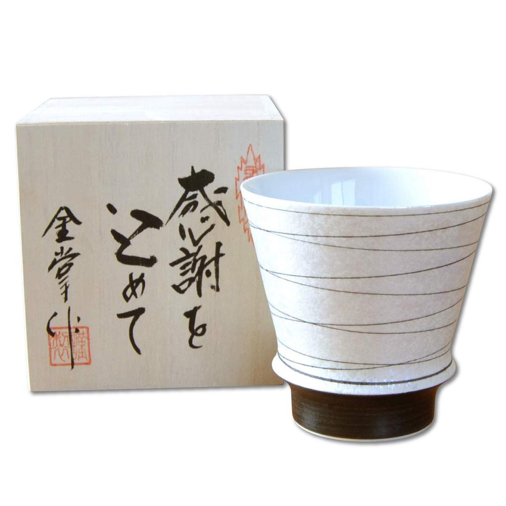 A perfect first paycheck gift for and anyone looking for This Arita ware shochu Kotobuki comes in a wooden parents, grandparents, gratitude. glass,