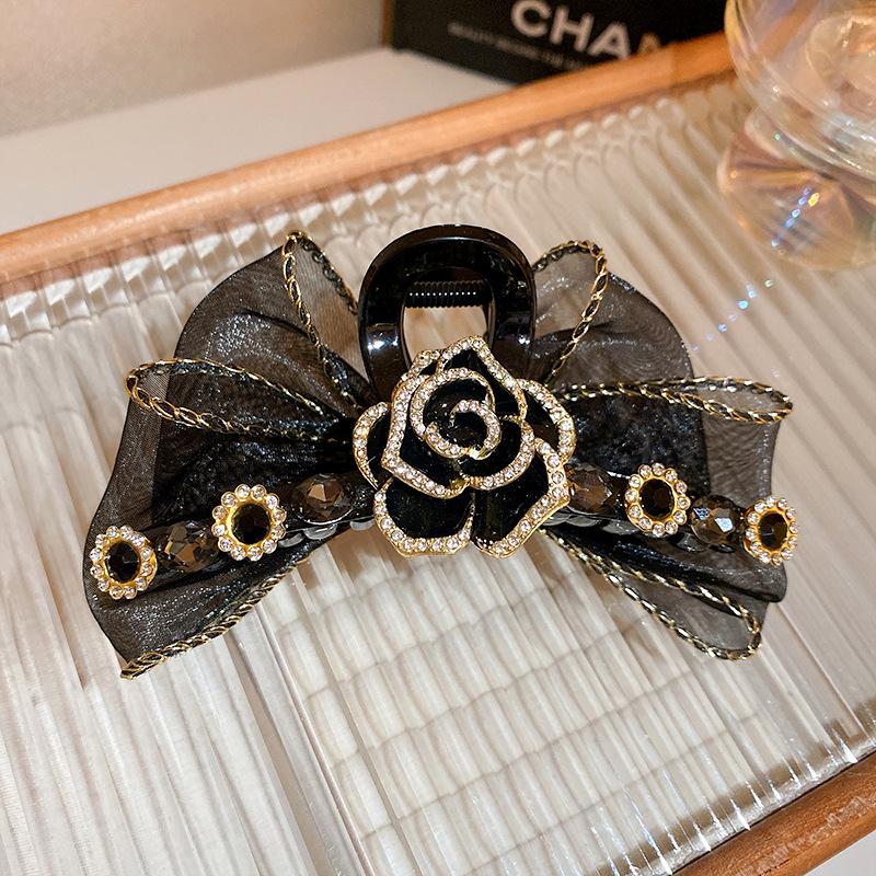 

Черная заколка-клипса для волос с камелией из страз и сетчатым бантом – Элегантный модный аксессуар для волос