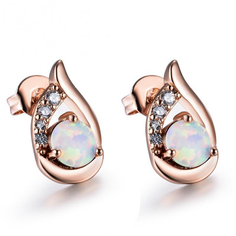 

Earrings Source Three-claw white Opal wing stud earrings
