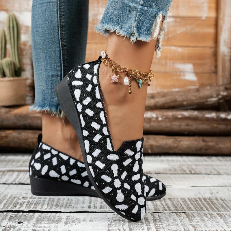 Women's shoes with niche-designed patterns, featuring comfortable flat soles, suitable for various outfits.