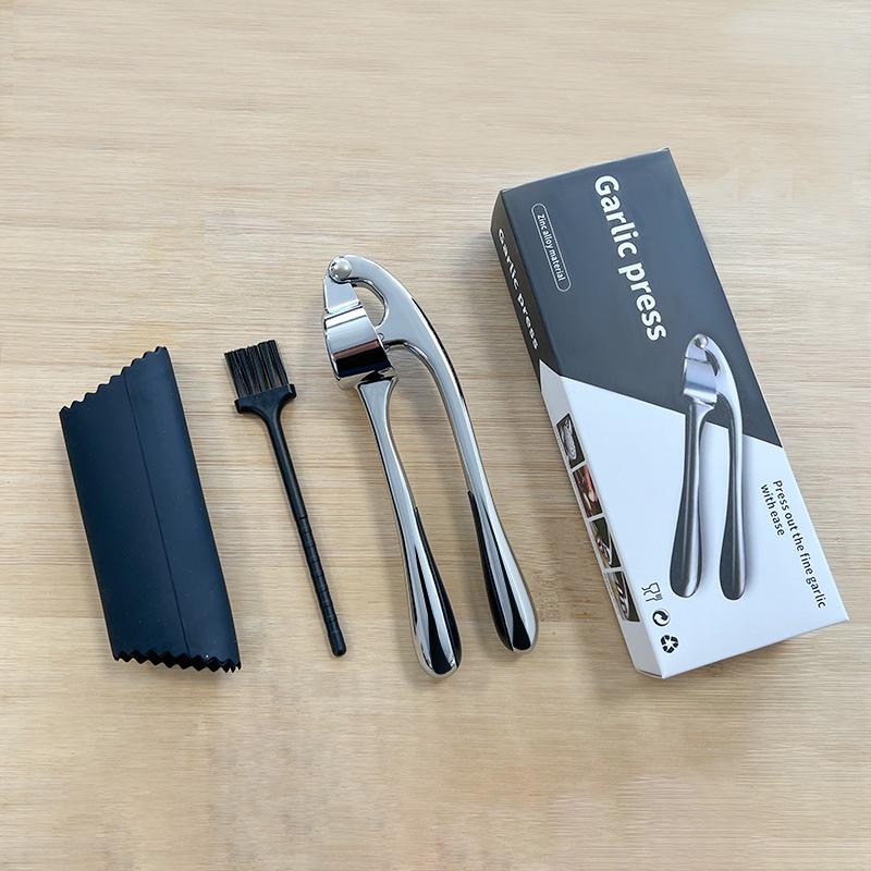 Manuell hvitløkspresse og stamper for kjøkkenbruk