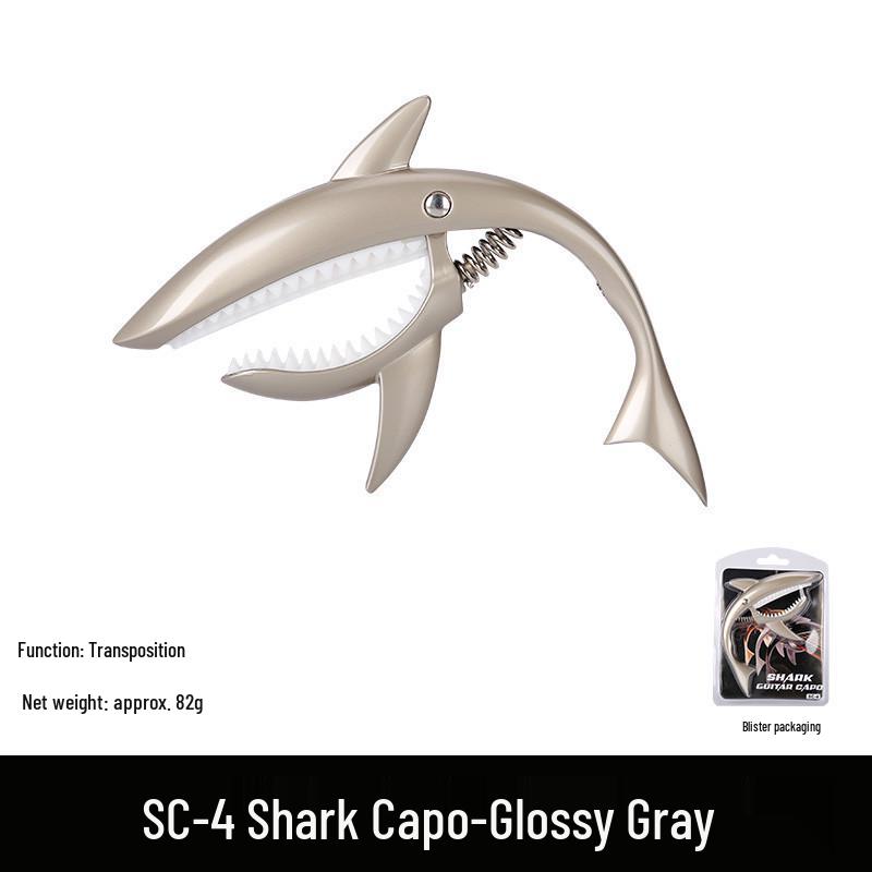 

Металлический каподастр для гитары Metal Shark из цинкового сплава с бакелитовыми накладками - Аксессуар для басового инструмента