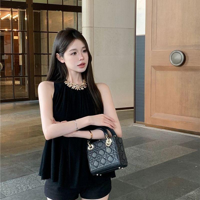 Schwarzes Chiffon Ärmelloses Lockeres Sommeroberteil für Damen mit Diamantenkette Stilvoll und Sexy