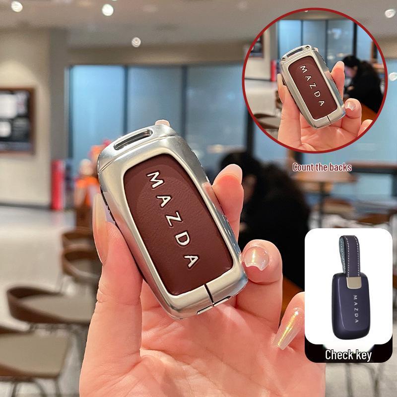 Kuooo: Wear-resistant, fully enclosed Mazda EZ6 key fob and EZ60 car remote protective cases with buckle.
