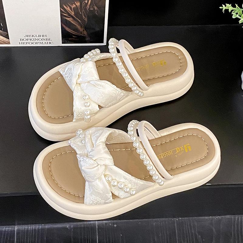 thick-soled pearl slippers for women to wear in the summer of 2025, new one-character cross-strap flat-bottomed cool slippers for women