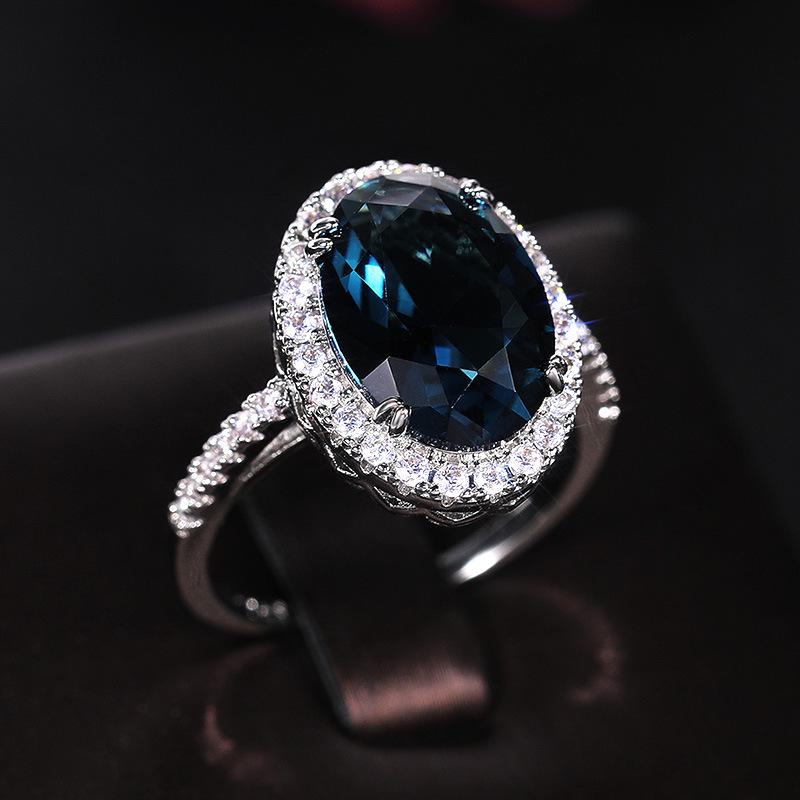 Cao Shi Wish Elegant Peacock Blue Zircon Egg-Shaped Ring for Women - Anniversary Celebration Accessory.