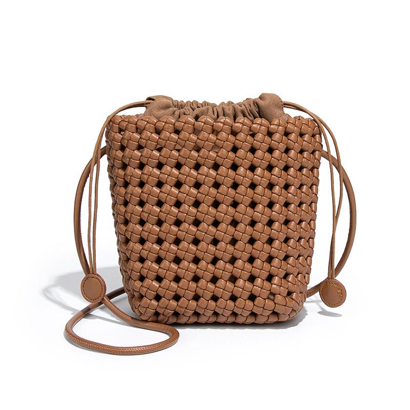 

Niche personality windmill knot hollow woven women s bag drawstring mother bucket bag vacation style casual versatile messenger bag