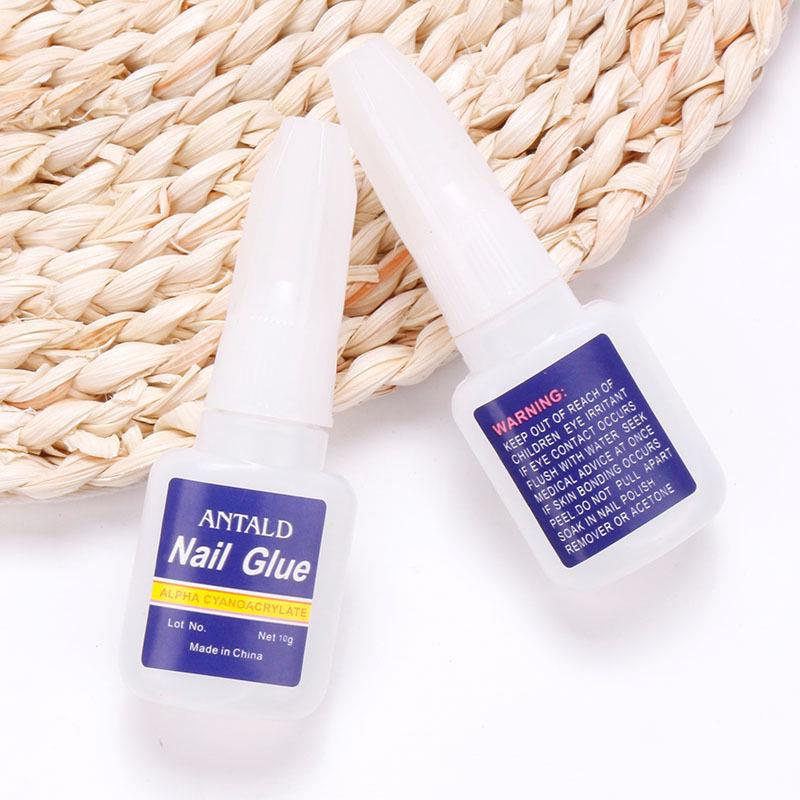 Quick-Dry Nail Glue 10g with Brush Head - Strong Adhesive for Nails and Rhinestones (Blue Bottle)
